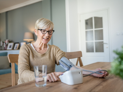 elderly woman taking blood pressure