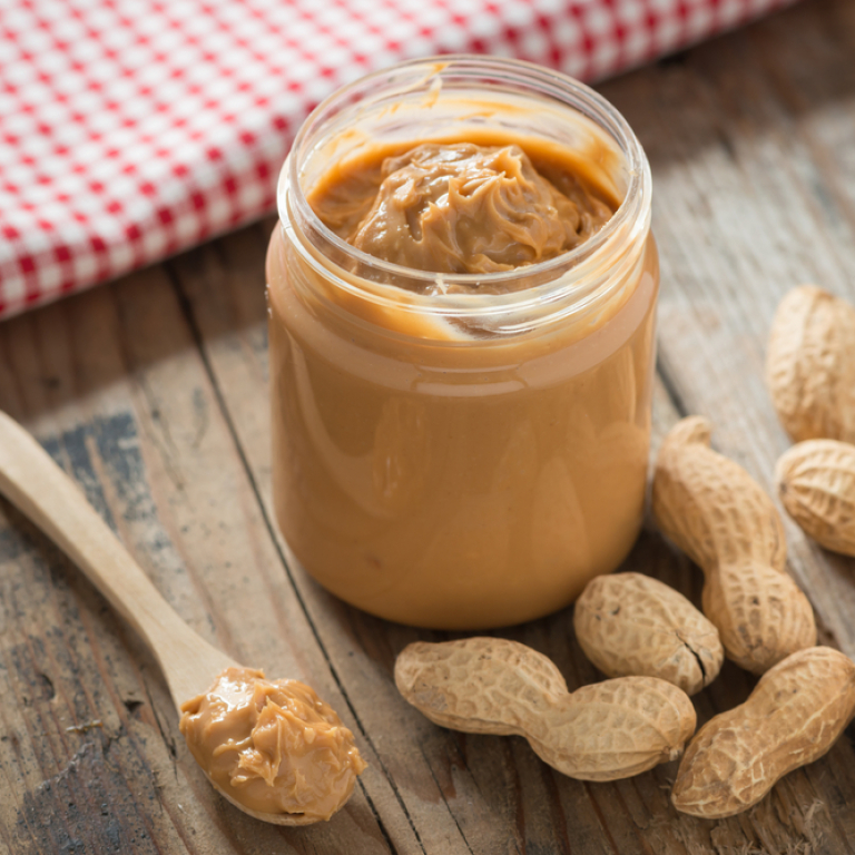 peanut butter surrounded by peanuts