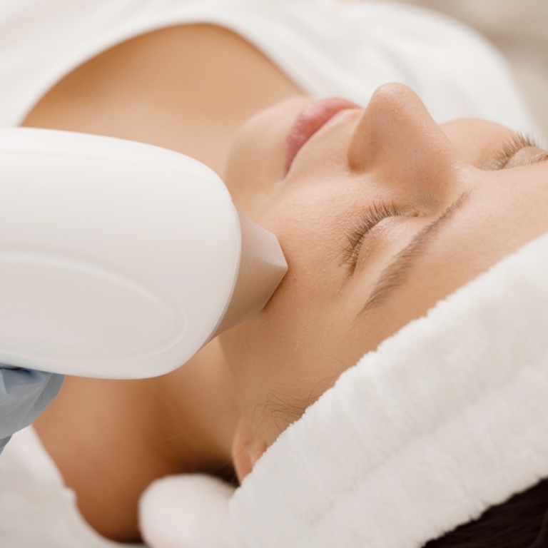 woman with ipl light on face